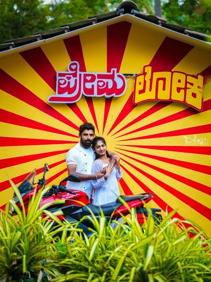 Another take on the 'Premaloka' theme, with the couple in all-white for a classic look.