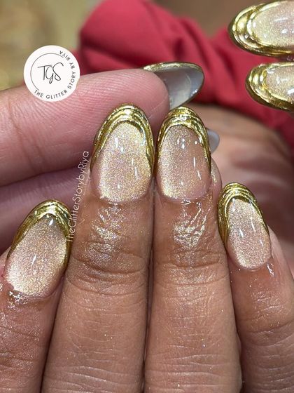 A macro shot showing the detail of the textured gold chrome tip over a beautiful golden cat-eye polish.