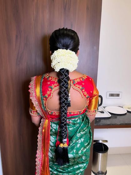 A beautiful look for a Seemantham (baby shower) ceremony. For the lovely mom-to-be Prathiba, I created a traditional look with a classic braided hairstyle adorned with fresh jasmine flowers.