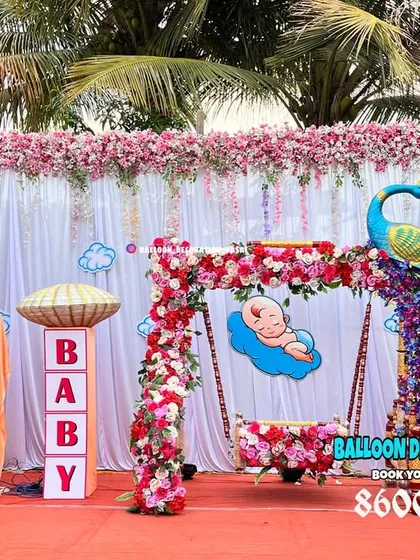 For a grand and traditional naming ceremony, I created this stunning outdoor setup featuring a floral peacock and a beautifully decorated baby jhula (cradle). The design combines vibrant colors with classic cultural elements for a truly royal feel.