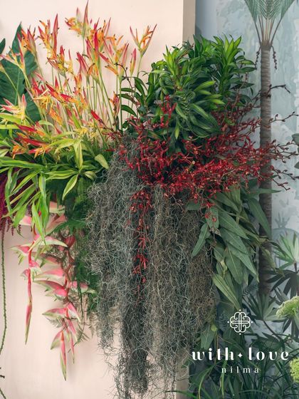A detail of the tropical foliage and flowers used in the 'Garden of Gaia' design, including Spanish moss and heliconia.