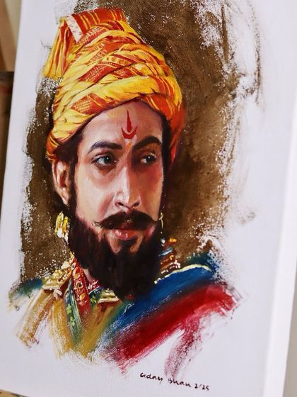 The Sambhaji Maharaj oil portrait shown on an easel, giving a sense of its texture and presence.