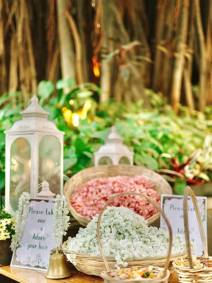 It's the little details that count. We set up this beautiful station with baskets of fresh flowers for guests to adorn their hair.