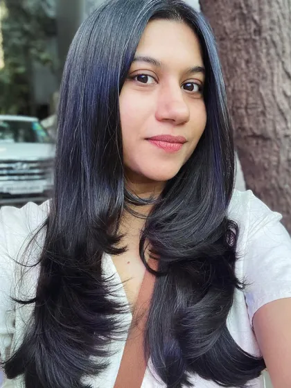 A fresh, simple haircut can make all the difference. Here, I created clean lines and subtle layers to give this beautiful long, dark hair a healthy and polished look.