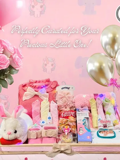 Perfectly curated for your precious little one. This pink-themed baby girl hamper is filled with an outfit, a soft bunny toy, hair accessories, and other adorable essentials.