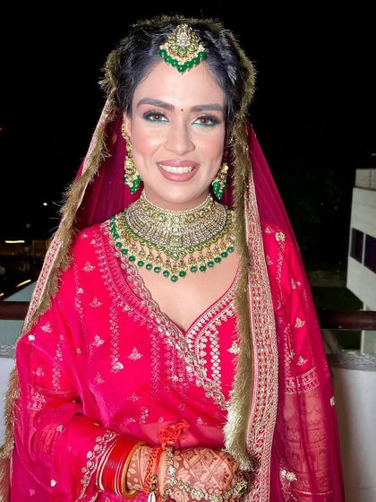 A full view of our "bridechilla" looking absolutely radiant. Her trust in our vision allowed us to create a glamorous yet personal look that she loved.