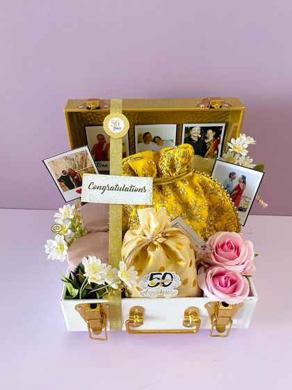 Another angle of the 50th Anniversary trunk. The gold and white color scheme adds a touch of elegance to this milestone gift.