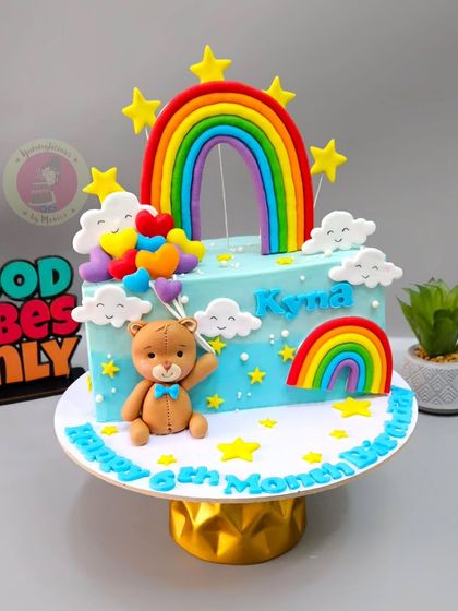 A rainbow and teddy bear themed half-birthday cake, celebrating six months of happiness.