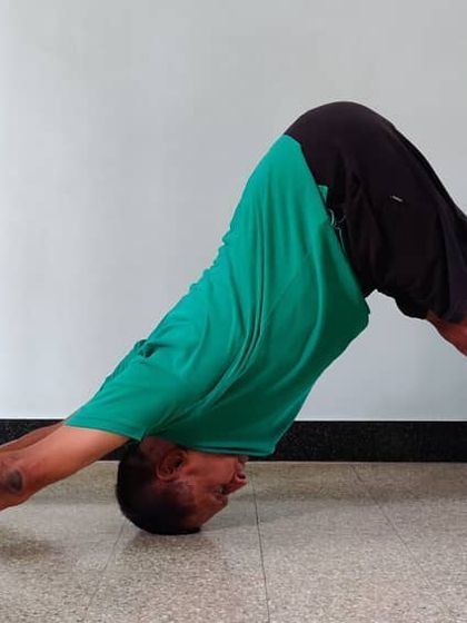 Adho Mukha Shvanasana (Downward-Facing Dog). This is a foundational pose that stretches and strengthens the entire body. The emphasis is on creating a long, straight line from the hands to the hips.