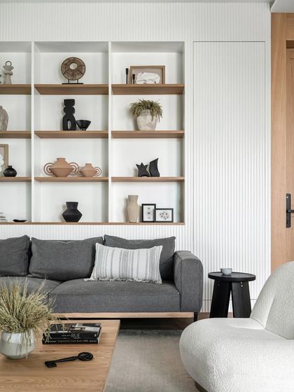 The remarkable 11-foot ceiling height in this residence is a rarity in Mumbai. We elevated the doors to 9’6” and used white oak veneer to bring an inviting warmth to the space.