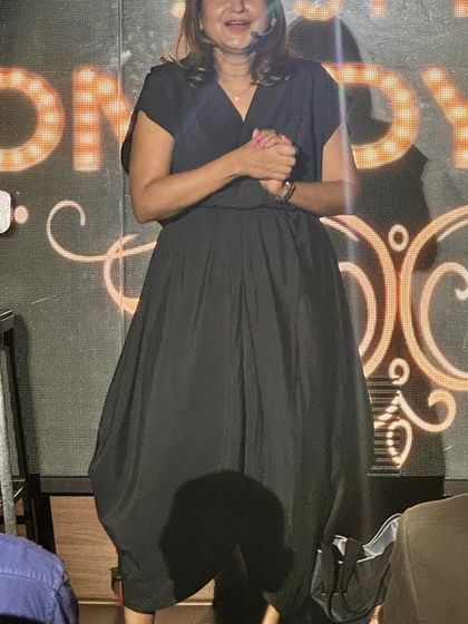 A candid shot of me on stage, interacting with the crowd during my stand-up set.