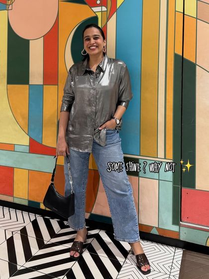 "Some shine? Why not!" This look pairs a metallic silver shirt with casual jeans, creating a trendy semi-formal outfit. It shows how to add a touch of glam to an everyday look.