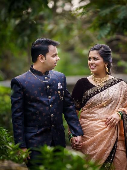 A romantic walk through a garden, capturing the couple in a natural and serene setting. This type of shot is perfect for telling their love story.