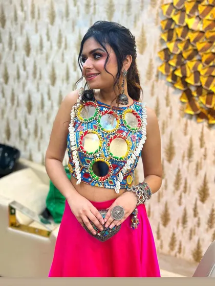 My vision for modern festive wear comes alive in this mirror-work crop top. It’s vibrant, playful, and perfect for a Navratri or sangeet night. I love designing pieces that are rooted in tradition but have a contemporary, fun twist.