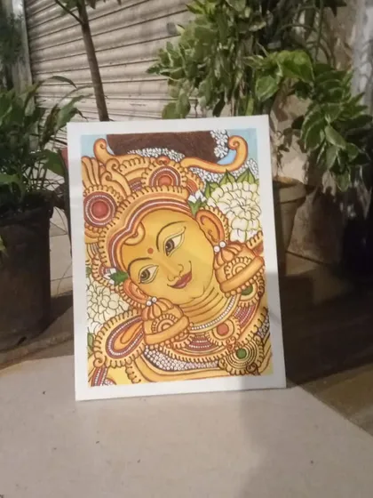 A completed Kerala mural of a goddess, showcasing the beautiful details in her jewelry and expression. This piece was created by a student in our masterclass.