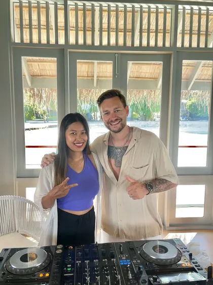 Posing with a fellow artist at an international gig. I love connecting with people from around the world through the universal language of music.