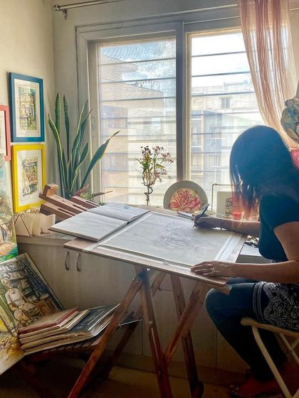 'Meri chhoti si duniya' (My small world). A candid photo clicked by my husband, showing me completely soaked in my world, my messy, happy art studio.