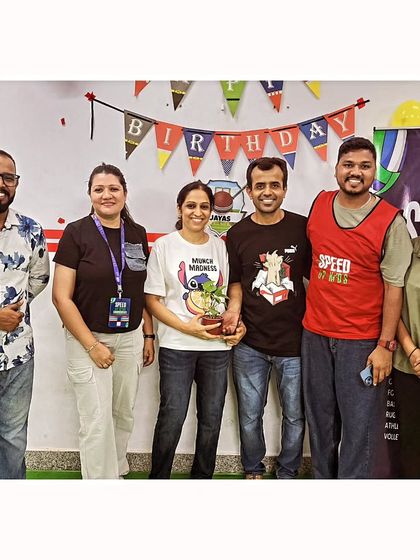 Our coaching team and parents gather for a group photo during a birthday party. These moments build a strong sense of community.