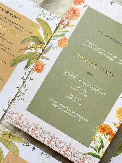 A detail shot of the gold foiling on the textured paper. The crisp lettering against the botanical illustrations creates a beautiful contrast and a touch of elegance.