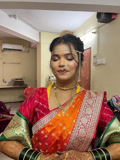 A stunning Vidhi look. I provided the complete service: natural makeup, a traditional khopa hairstyle, and perfect saree draping.