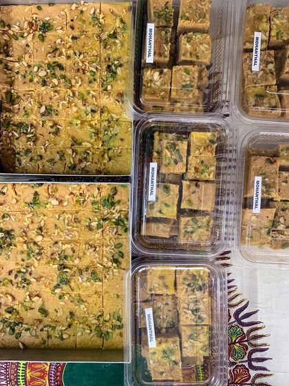 Large trays and packed boxes of my signature Mohanthal. I prepare this festive sweet in bulk for large orders and celebrations.