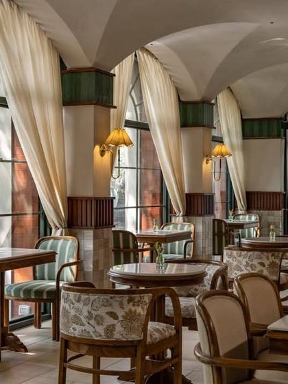 'Cafe Wink' in New Delhi by Studio Dangg reinterprets a classic Italian trattoria with soft arches, vaulted ceilings, and a warm, inviting atmosphere.