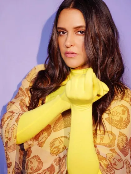 I love working with bold and unconventional pieces. Here, I styled Neha Dhupia in a unique printed dress from Huemn, paired with vibrant neon yellow gloves for a high-impact, artistic statement.