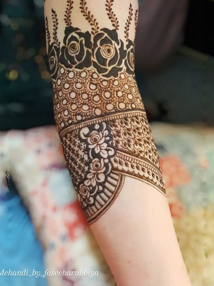 A beautiful bridal start-up, featuring a band of bold roses and delicate filler work.