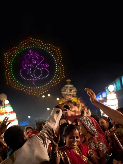 A celebration of Indian culture with a Ganesha drone formation over a festive crowd. As a leading drone show provider in India, I specialize in creating shows that resonate with local traditions.