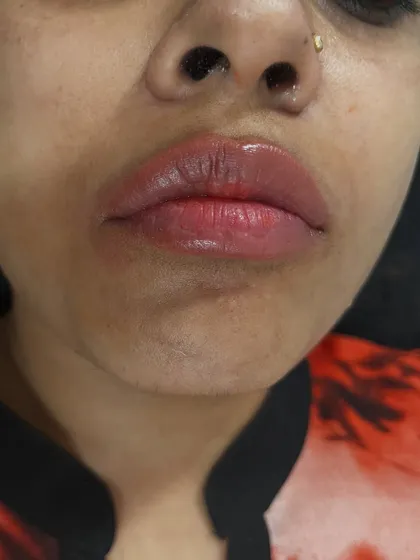 A close-up view of the same client's lips, showing the smooth application and the lovely, glossy finish of the lip blush.