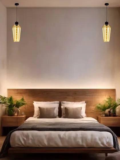 Symmetrical pendant lights with a woven texture hang on either side of the bed, offering a modern alternative to traditional bedside lamps. This design choice creates a clean, sophisticated, and balanced look.