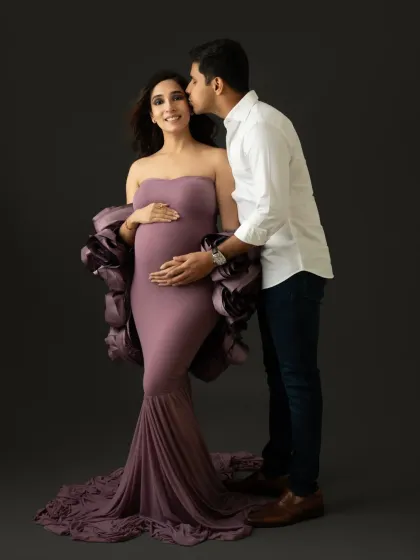 A sweet kiss from the proud dad to be. I always encourage partners to join in for a few shots, even during a glam session focused on mom.