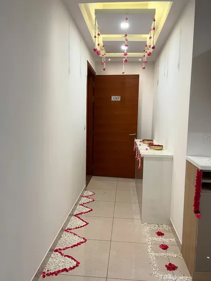 An identical shot of the decorated hallway for the housewarming.