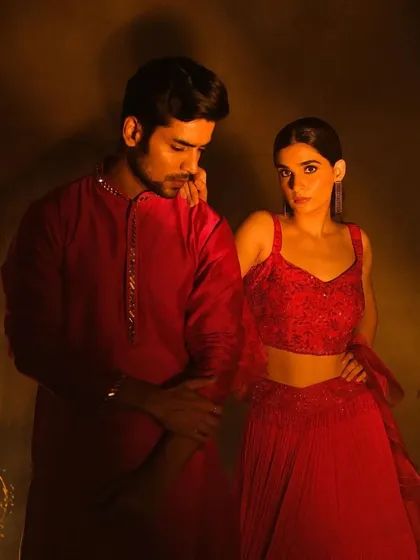 An elegant couple's pose from a campaign shoot. The makeup for both the bride and groom is polished and complementary, creating a harmonious and picture-perfect look.