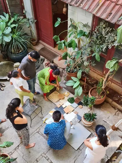 An overhead view of a client and team material selection meeting in our green-filled studio.