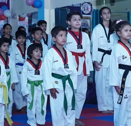 A line of my younger students standing at attention. Discipline and respect are the first lessons I teach, forming the foundation for everything else.