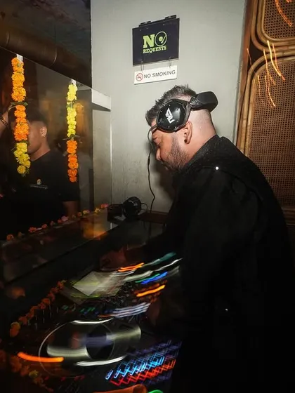 A creative shot with light trails from the mixer, showing the dynamic nature of DJing.