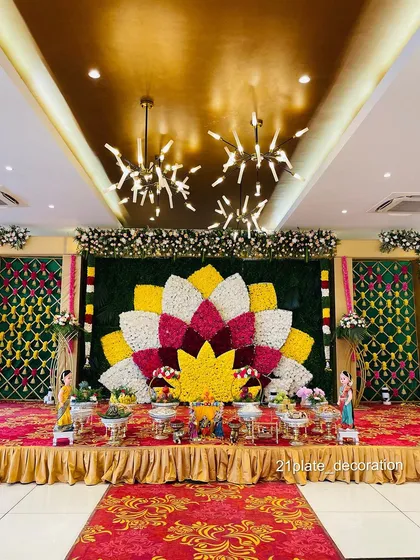 This wide view shows the scale of a grand floral backdrop I created for a function. The large lotus design made of fresh flowers becomes a stunning centerpiece for the entire hall, perfect for photos.