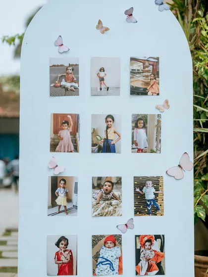 A personalized photo board celebrating the birthday girl's journey through the years. This arch, adorned with butterflies, offered a sweet, sentimental touch to the decor.