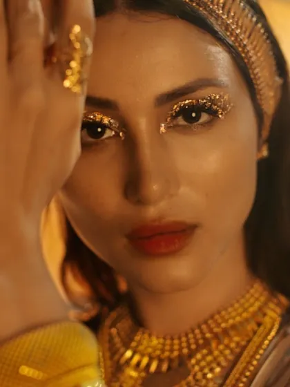 Bringing a creative vision to life for the Bhima Jewellery campaign. This look features dramatic gold glitter on the eyes and a bold red lip, creating a high-fashion, artistic statement that is both powerful and beautiful.