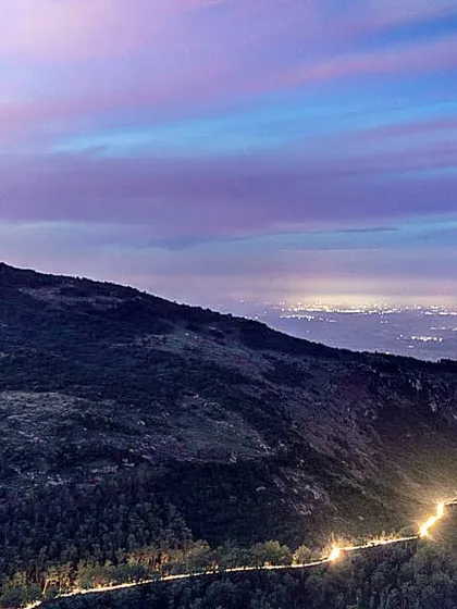 This is a long exposure shot of Nandi Hills after sunset. I wanted to capture the winding road lit by car lights, contrasting with the dark hill and the colorful twilight sky. It shows how a landscape completely changes at night.