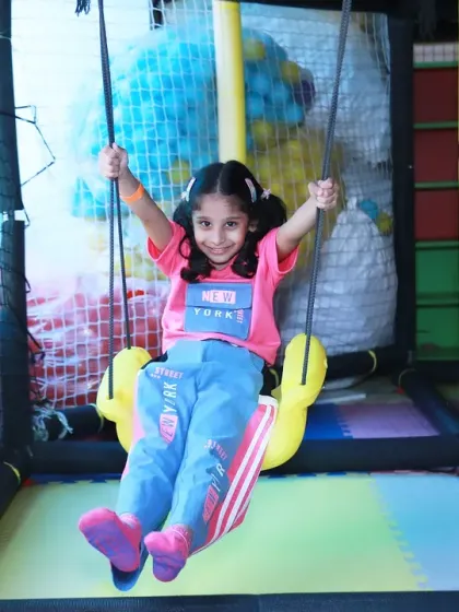 The pure joy of a girl on a swing at an indoor play zone. My event photography is all about capturing the action and excitement of the celebration.