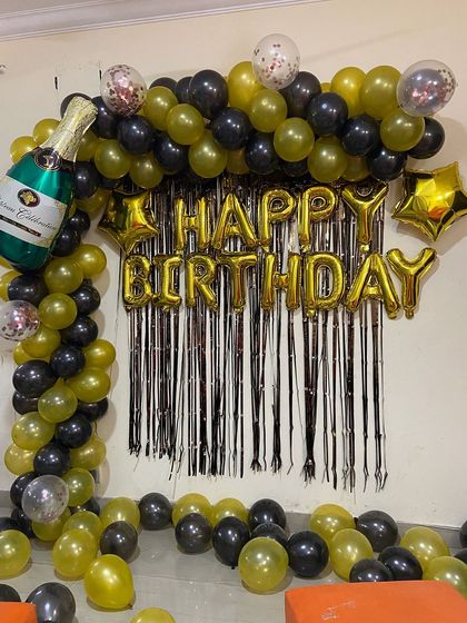 I include confetti balloons within the arch to add a touch of sparkle and fun.