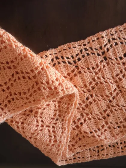 The soft drape of the Sharad Ritu scarf. It's made with a lightweight DK yarn, which gives it a lovely, breezy feel.