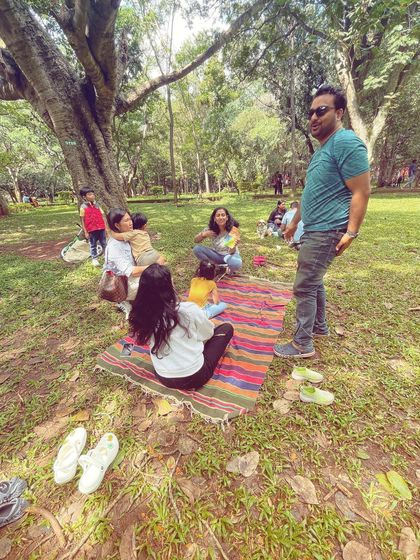 Some days are beautifully chaotic, and that's the reality of outdoor storytelling with toddlers. This picture shows the mix of listening, playing, and wandering that makes each session unique and memorable.