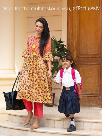 A heartwarming shot from the Ek By Ekta campaign, showing a multitasking mom. I styled her in an outfit that is both beautiful and practical for a busy day.