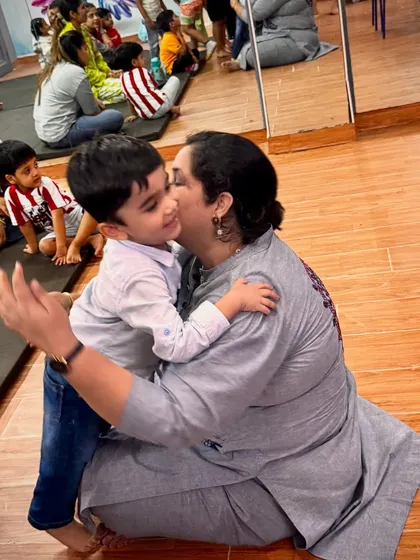 It's all about the connection. A warm hug between an instructor and a happy child captures the safe, nurturing, and family-like environment we cultivate in all our workshops and classes.