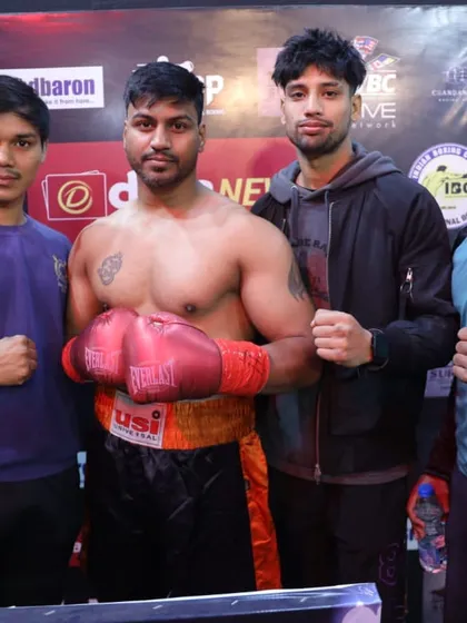 A pro boxer with his team after a hard-fought match. The corner team is as important as the fighter himself.