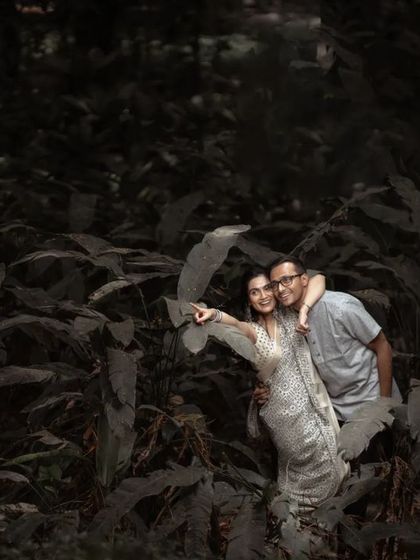 A playful and happy moment during a pre-wedding shoot in the woods. We encourage couples to have fun and be themselves, resulting in genuine smiles.