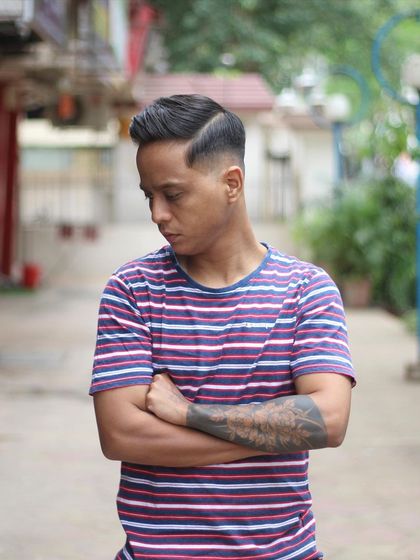 A sharp, classic side-part for my client. This timeless look is all about clean lines and a polished finish.